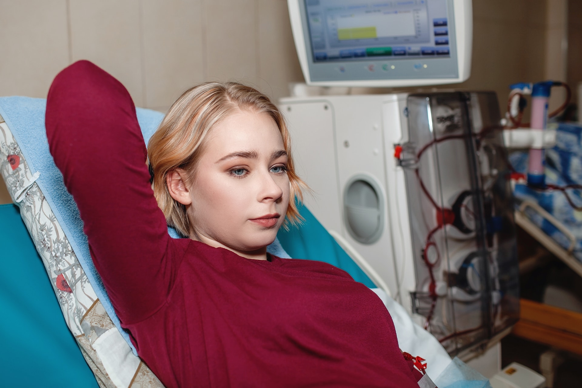 Young girl on hemodialysis in hospital, dialysis system equipment, kidney disease chronic patient